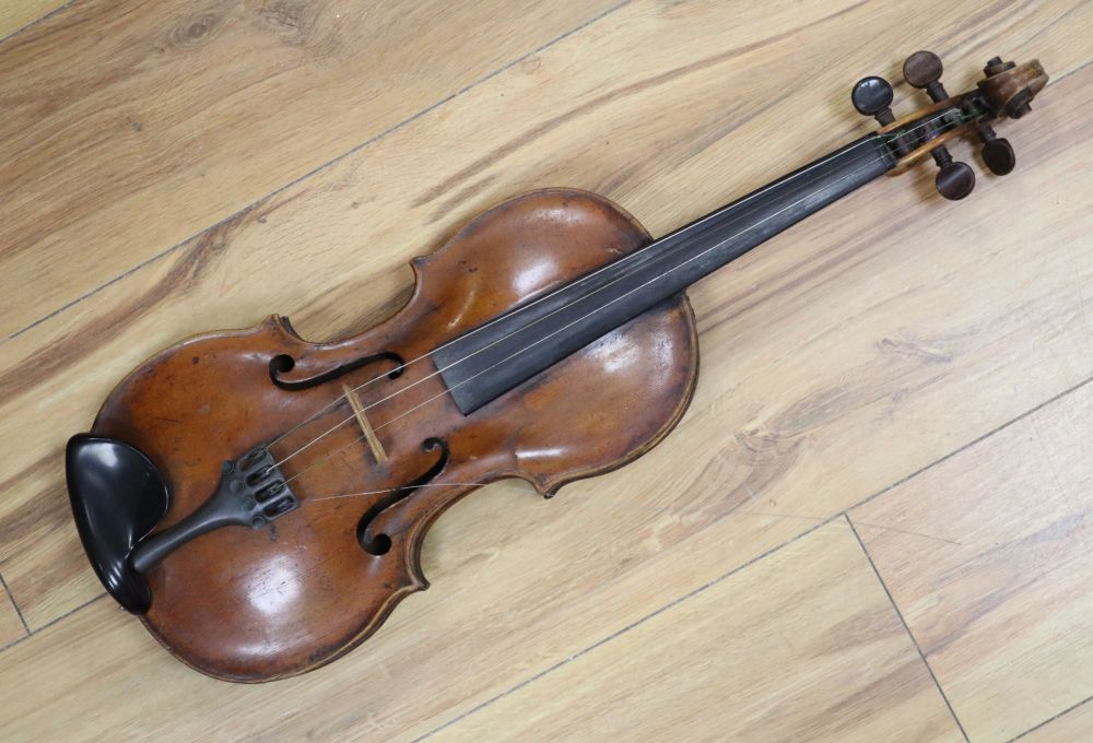 A cased violin with two bows. Violin bears the label Carl Willhelm Claesel, circa late 18th century/early 19th century, 35.5cm back in